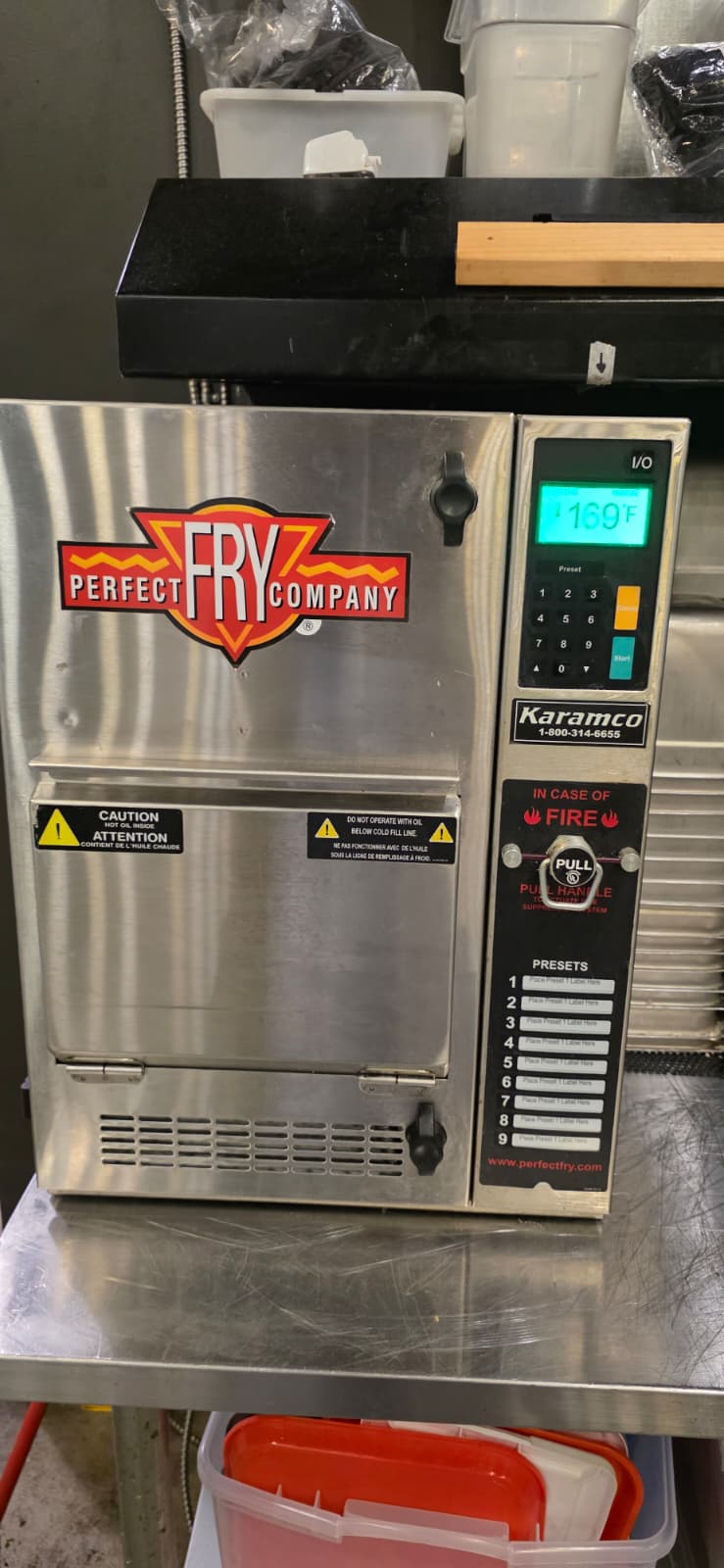Perfect Fry stainless-steel front exterior and control panel after deep cleaning, with the doors closed and display illuminated.