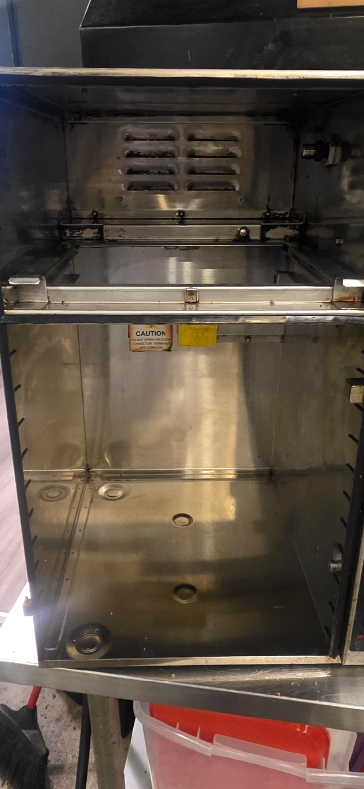 Open Perfect Fry interior after deep cleaning, showing the upper vented panel, tray, and empty lower compartment.