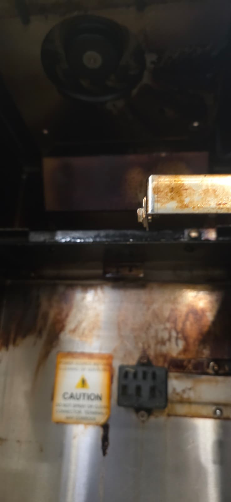 Perfect Fry interior fan and rear panel with grease buildup before deep cleaning.
