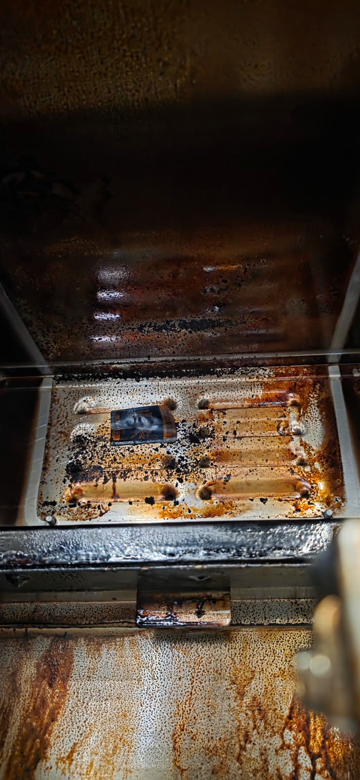 Perfect Fry interior tray and walls coated with grease and dark residue before deep cleaning.