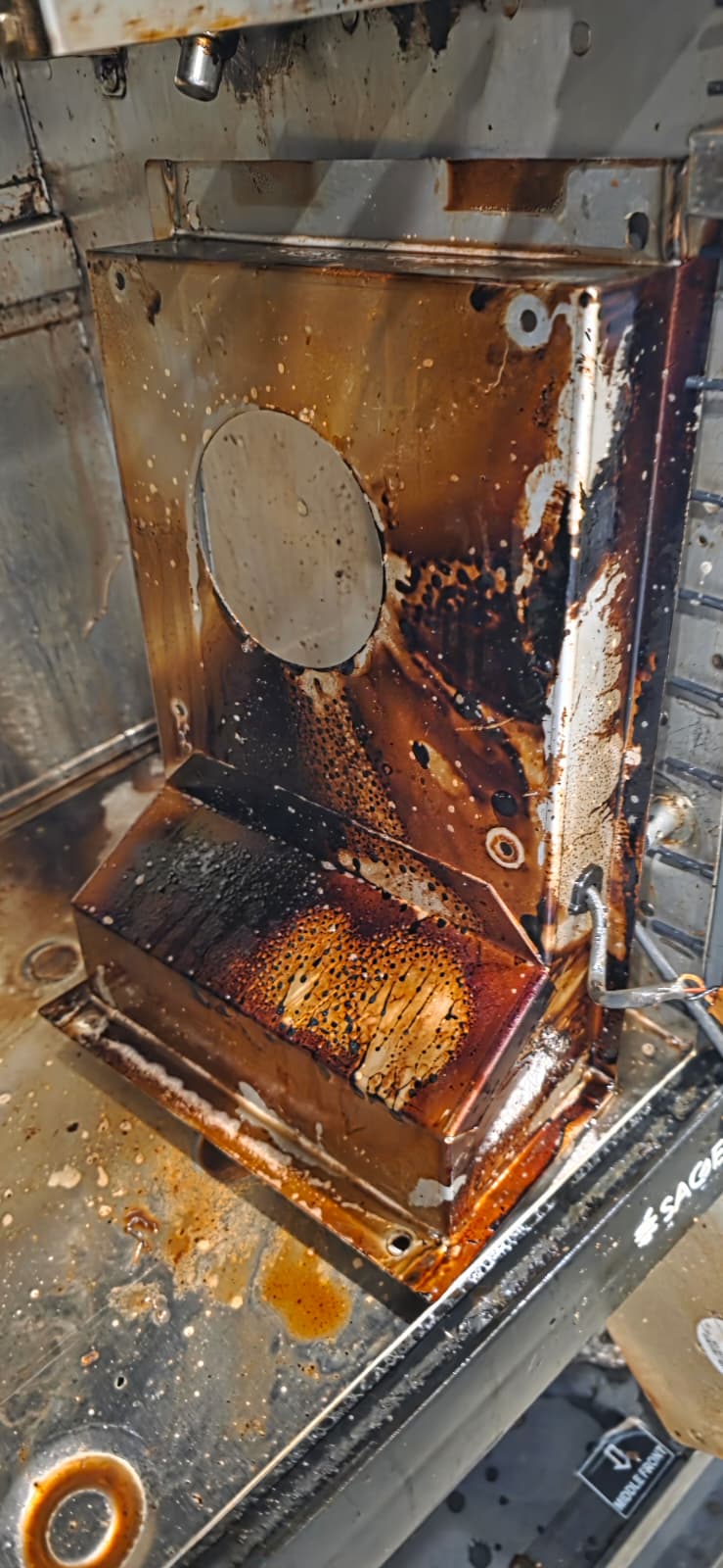 Perfect Fry fan housing and base with heavy grease buildup before deep cleaning.