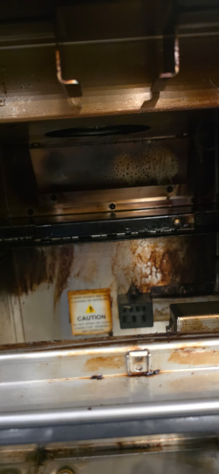 Open Perfect Fry interior showing grease streaks on the rear panel and front edge before deep cleaning.